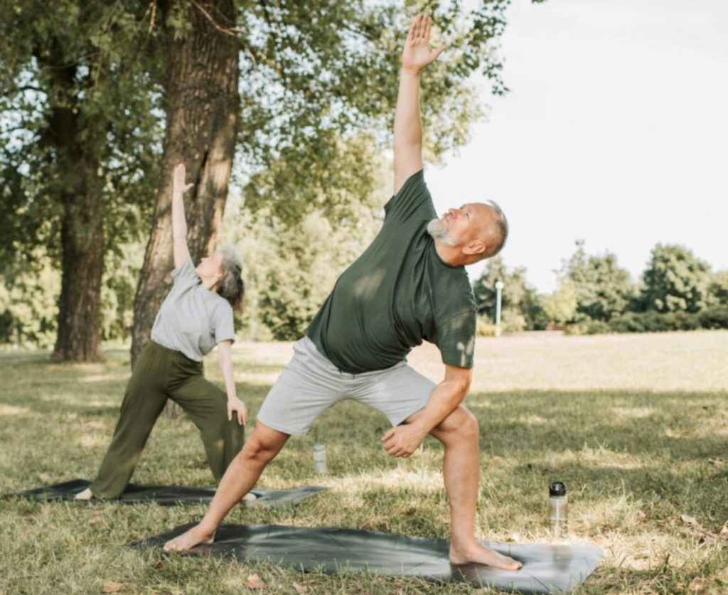 A man doing yoga. He is happy because he has good erectile function following his prostate cancer treatment.